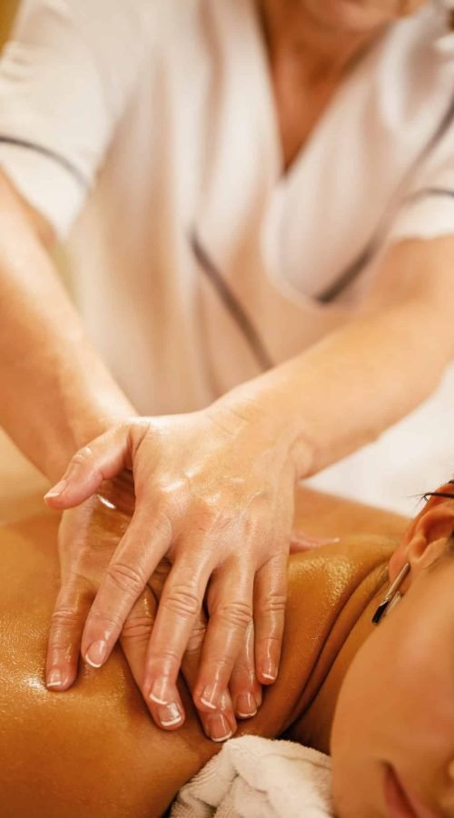 Close-up of shoulder massage at the spa.